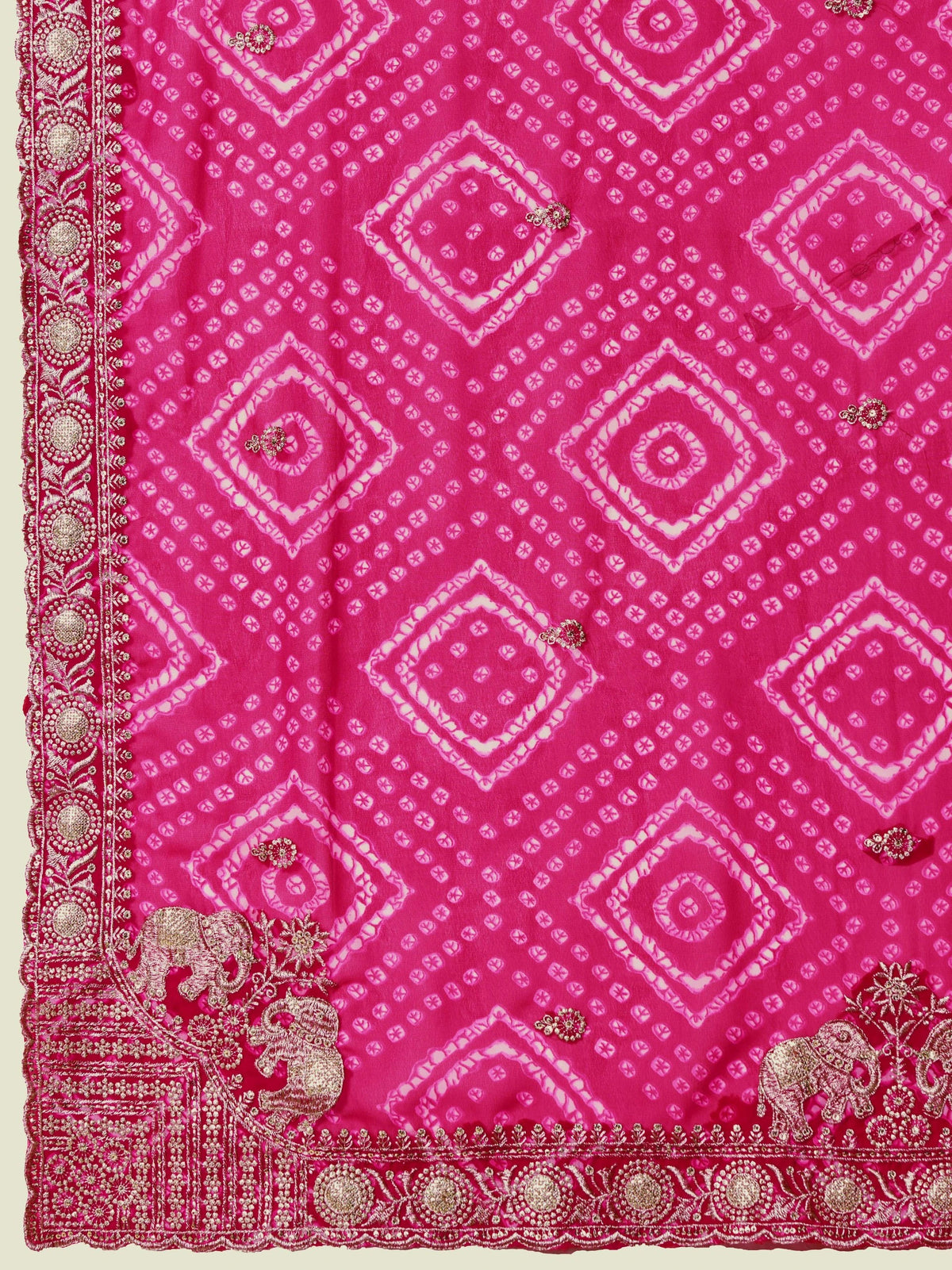 Pink fabric with white diamond pattern and decorative border