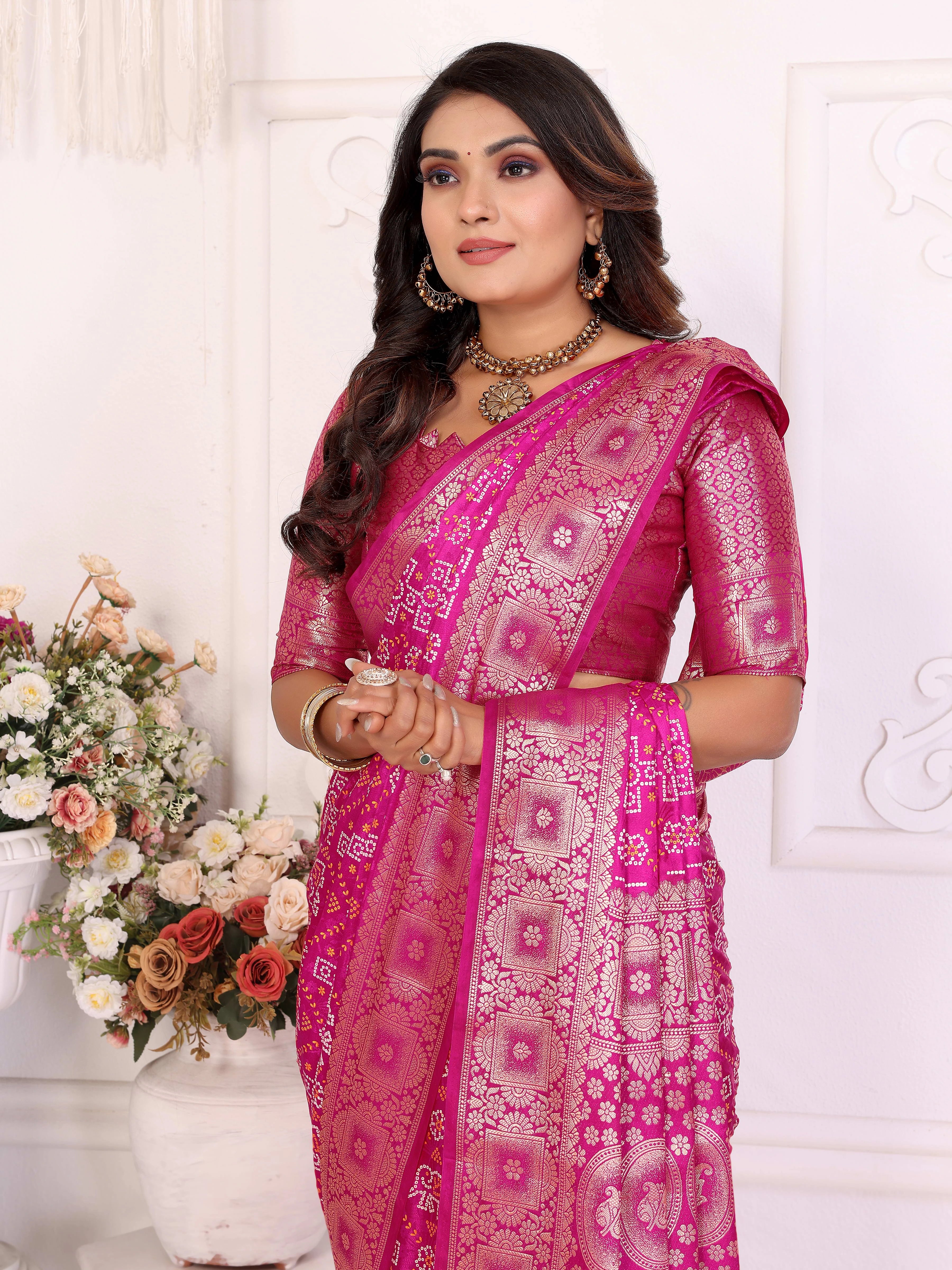 Woman wearing a pink saree with a white background