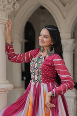 Woman in a colorful traditional outfit standing in front of an architectural background