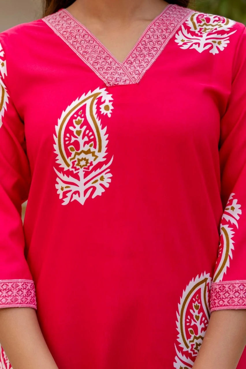 Red traditional outfit with white embroidery on a blurred background