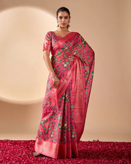 Woman wearing a pink saree with floral patterns on a beige background