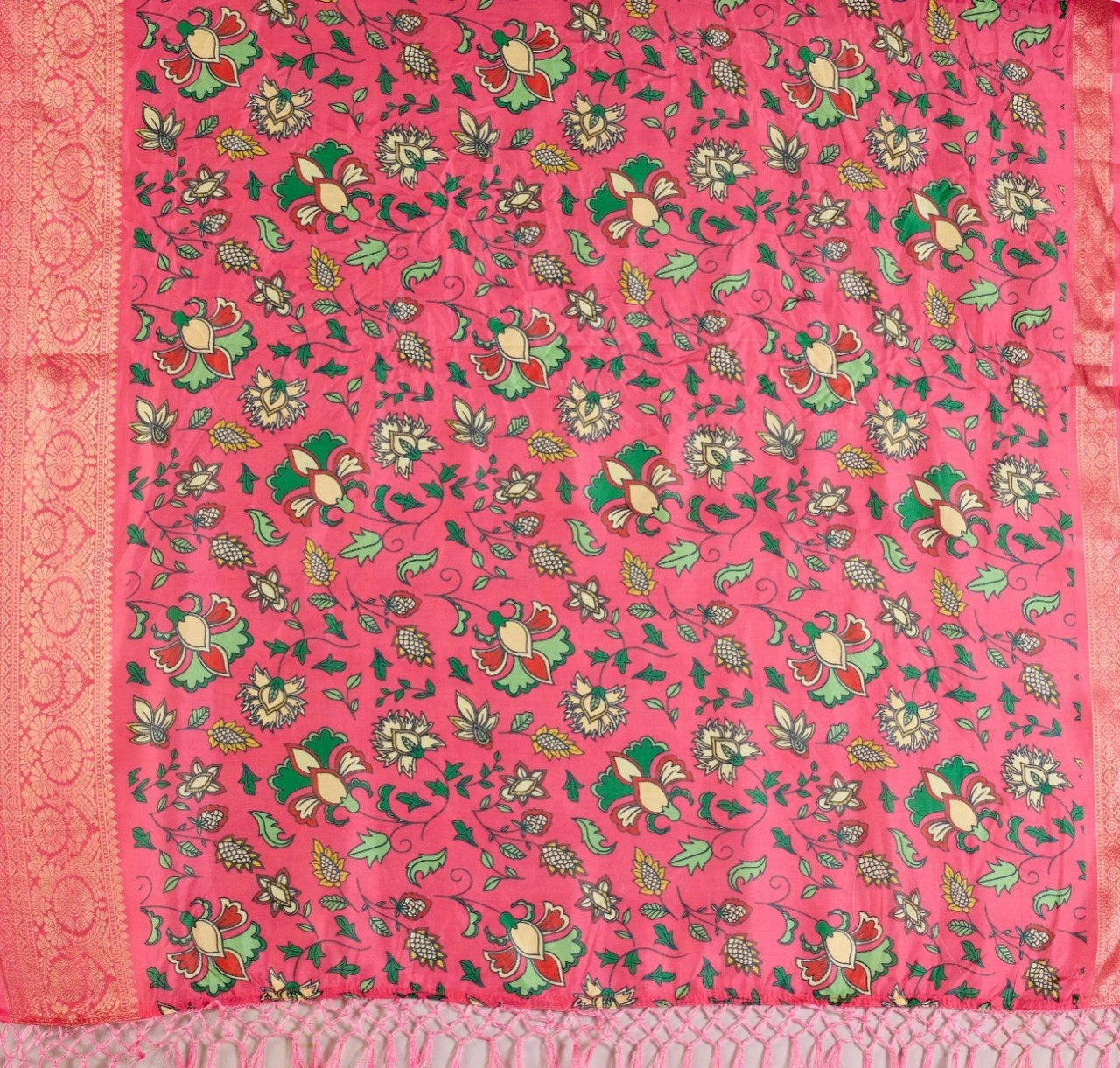 Pink fabric with green and gold floral patterns