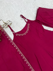 Maroon dress with lace details on a white background