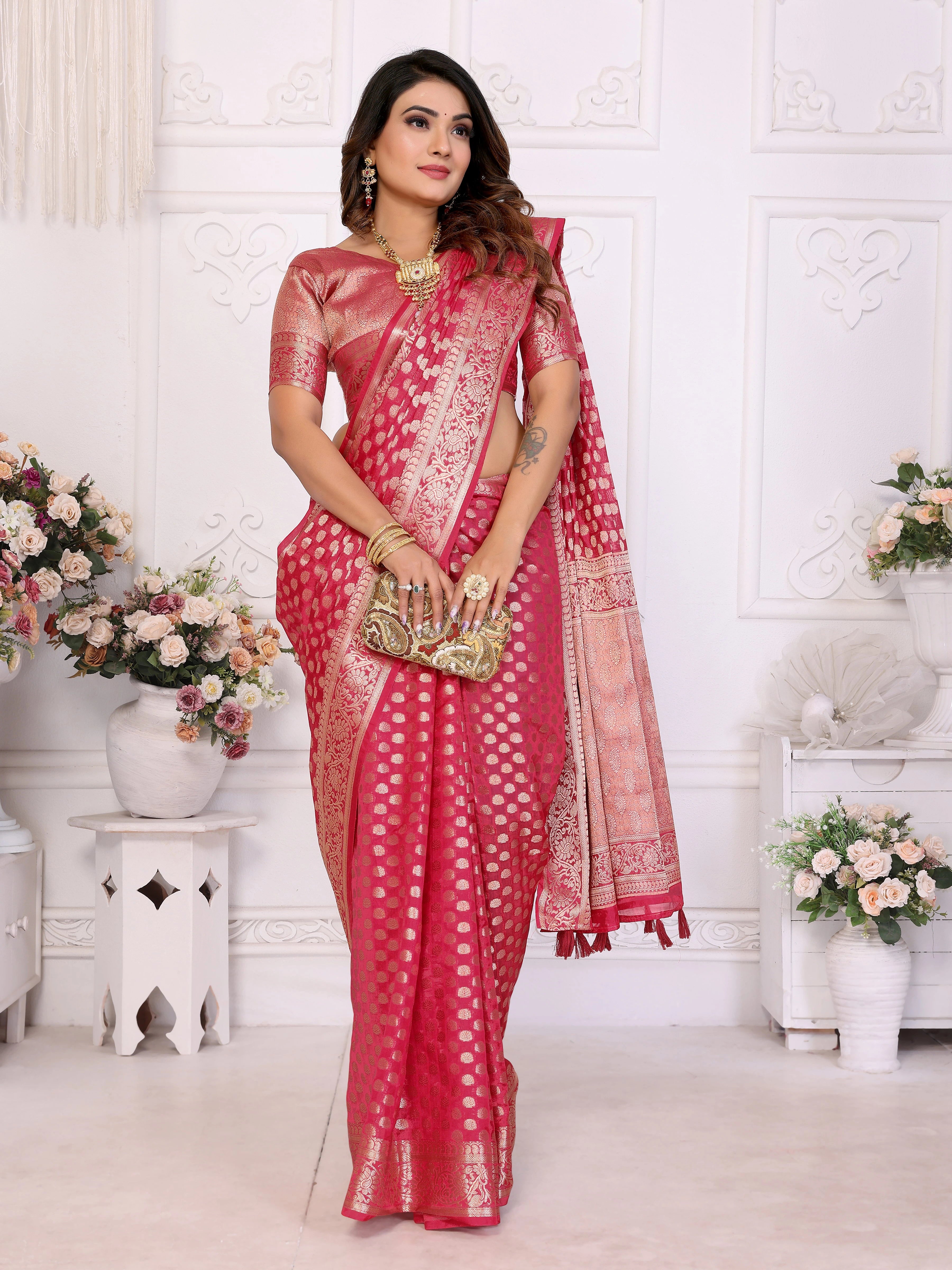 Woman wearing a red saree with a white background
