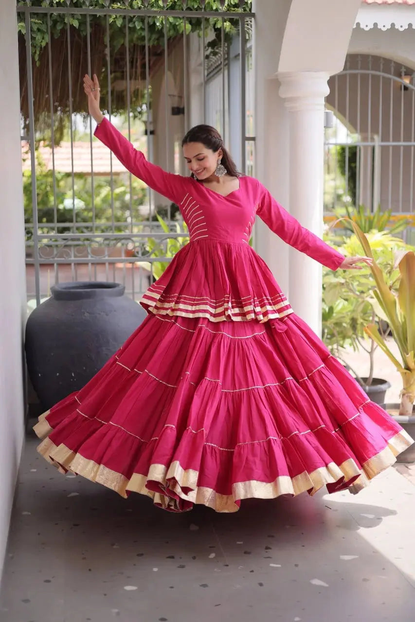 Gorgeous Pink Lehenga Set with Designer Peplum Top, Flowing Layers, and Festive Golden Border Finish
