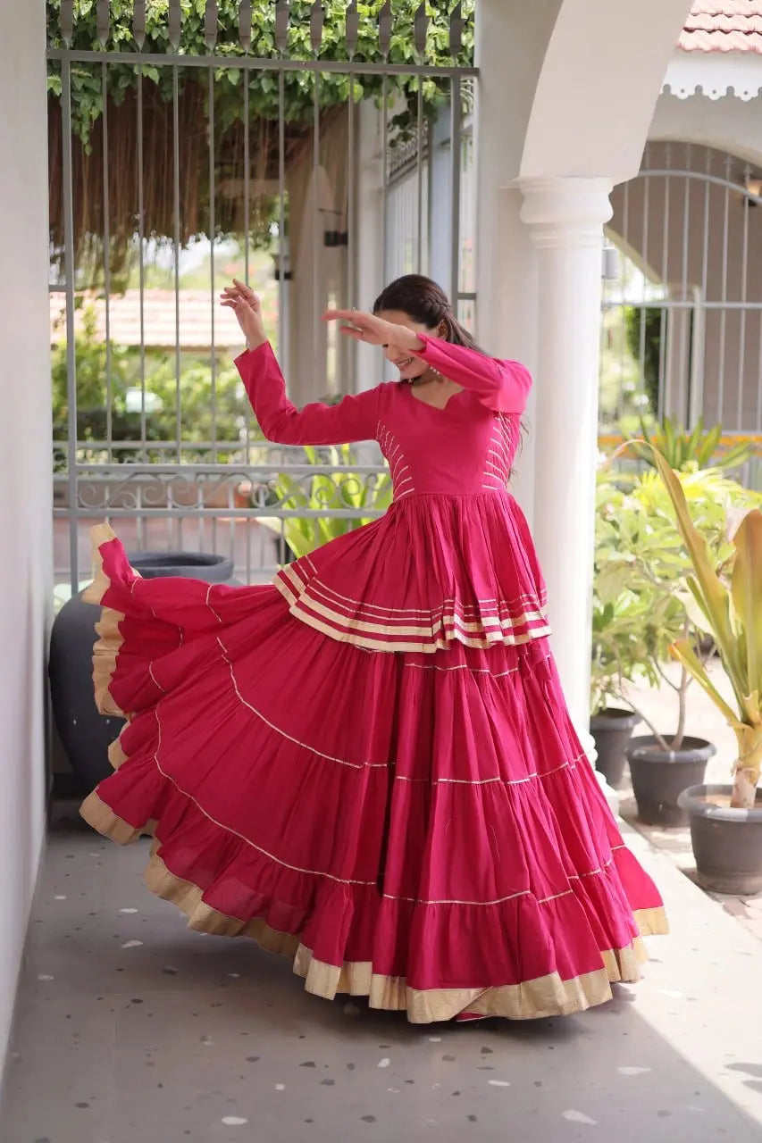 Premium Rani Pink Party Wear Lehenga with Tiered Design, Golden Trim, and Graceful Traditional Look