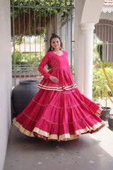 Elegant Rani Pink Lehenga Choli Set with Multi Layer Flare and Rich Golden Hemline for Wedding Functions