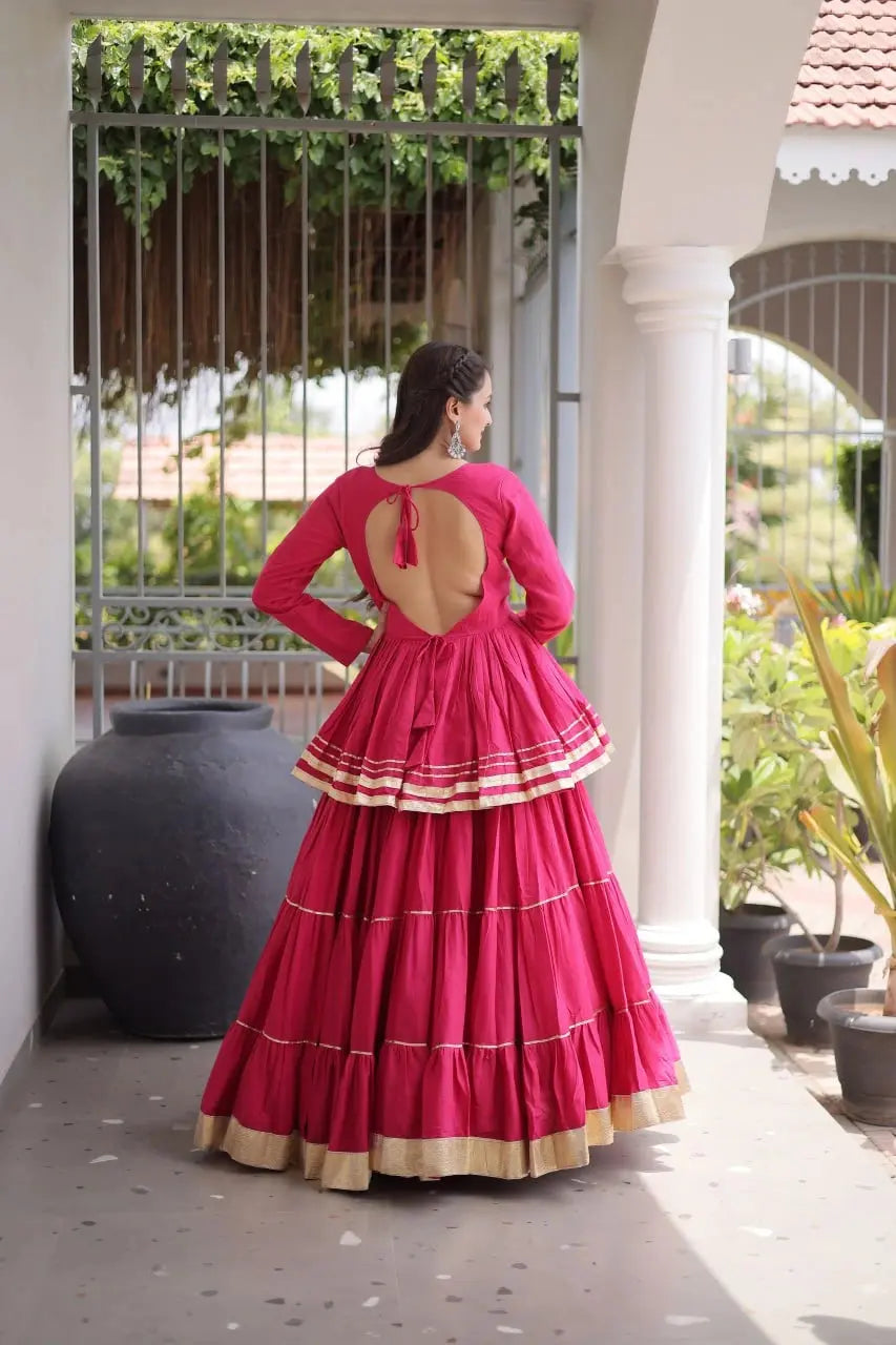 Women's Festive Pink Lehenga Dress with Layered Ghera, Golden Border Accents, and Timeless Ethnic Style