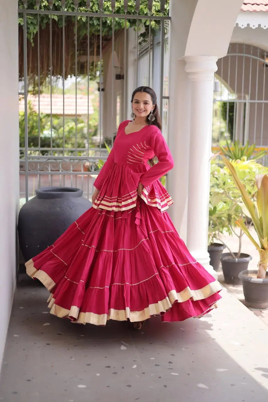Festive Wear Magenta Lehenga Set featuring Full Sleeve Blouse, Layered Skirt, and Elegant Gota Border