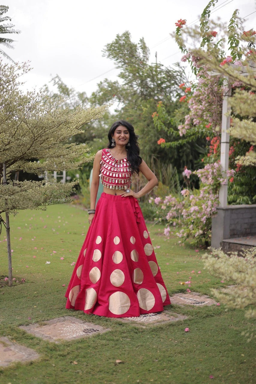 Gorgeous pink lehenga with shimmering mirror embellishments and golden accents delivers timeless festive elegance for every celebration.
