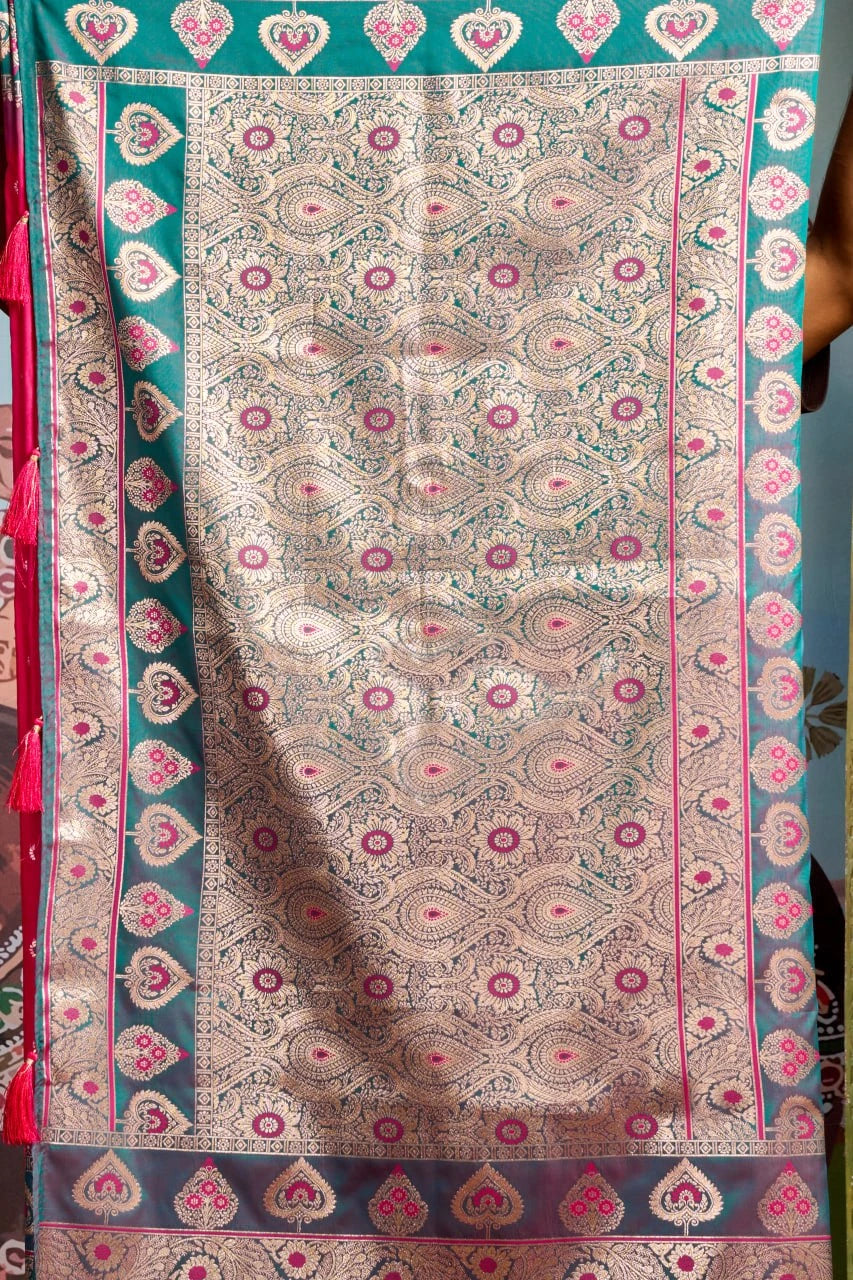 Decorative fabric with intricate patterns and colors, held by a person.