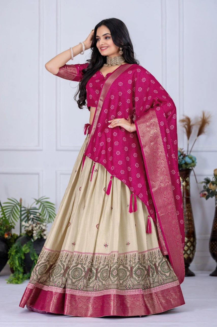 Woman wearing a traditional outfit with a pink dupatta and beige lehenga against a white background.