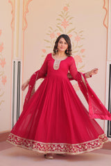 Woman wearing a red traditional outfit with floral patterns in the background