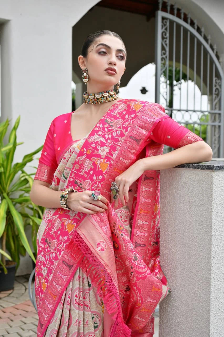 Close-up of dark pink silk saree highlighting shimmering golden zari craftsmanship
