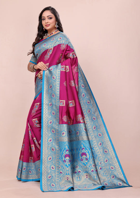 Woman wearing a pink and blue saree with a beige background