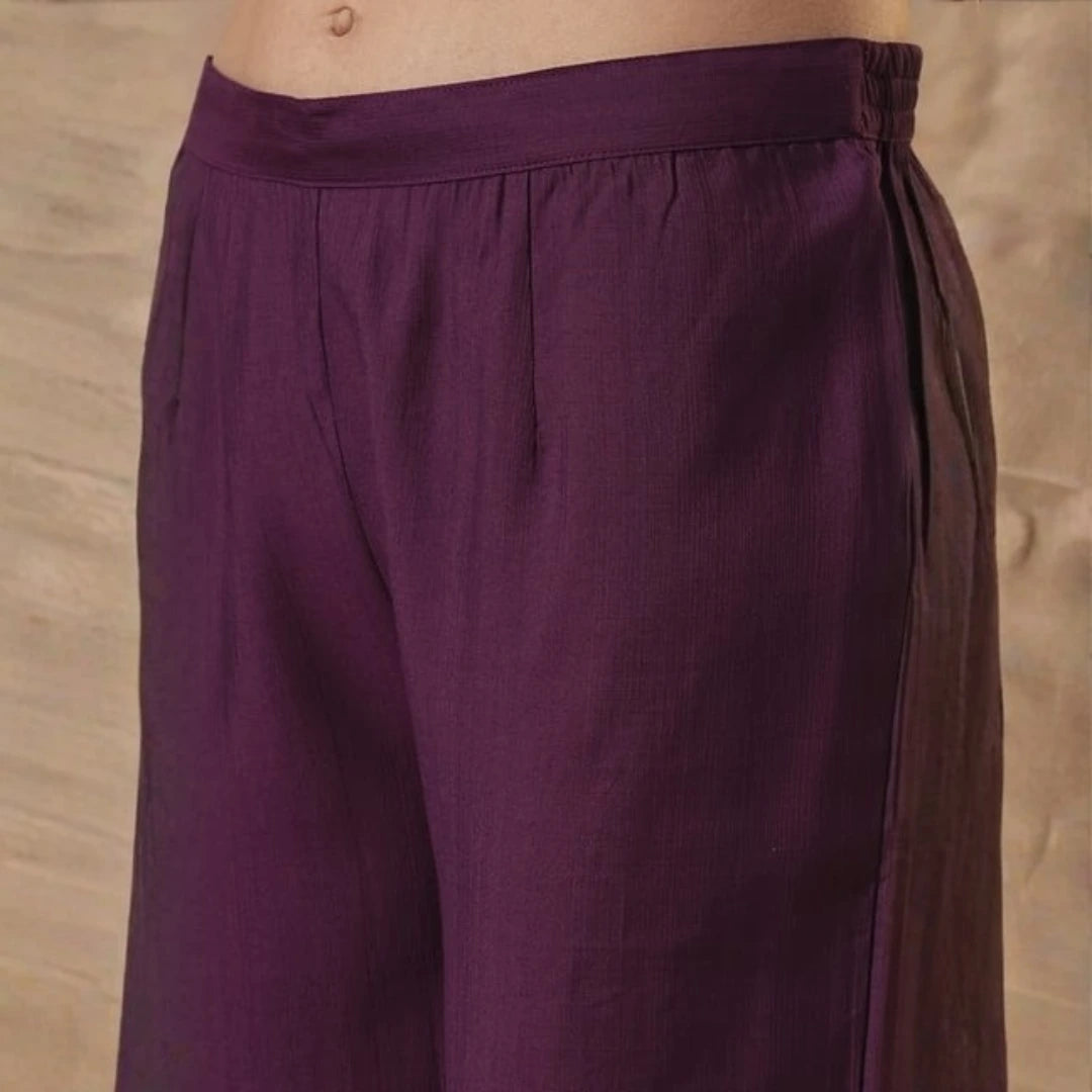 Purple pants on a neutral background