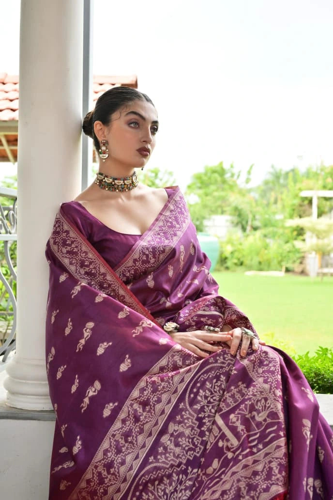 Woman in a purple saree with a white background