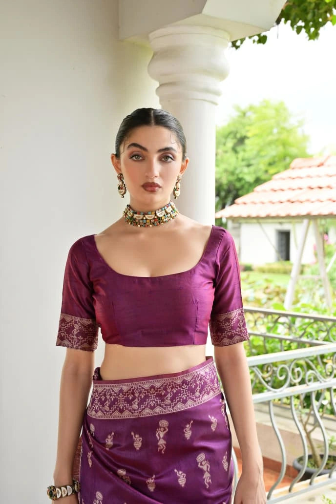 Woman wearing a purple traditional outfit with a white background