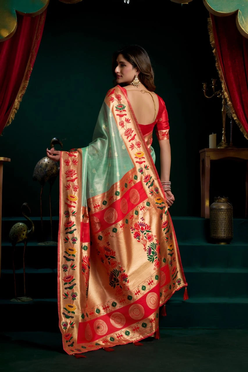 Woman in a traditional saree with a dark background