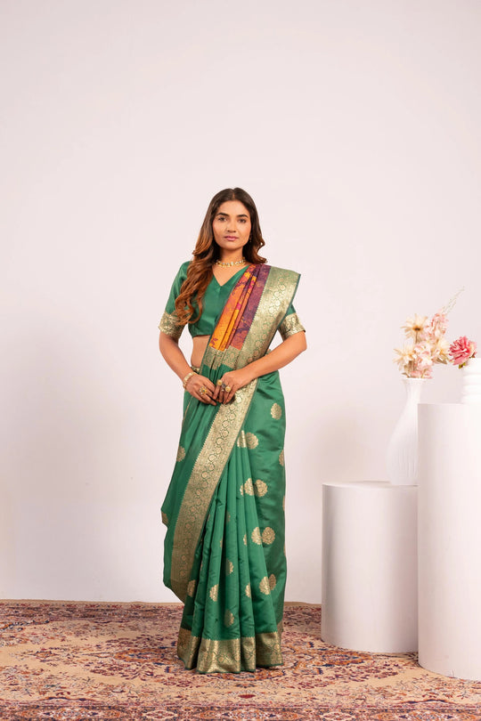 Woman wearing a green saree with a white background