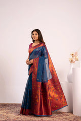 Woman wearing a blue and red saree with a white background