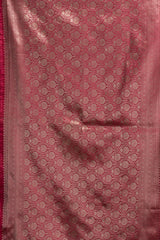 Pink fabric with a subtle pattern, possibly a saree or a similar type of fabric.