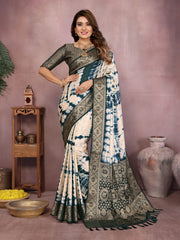 Woman wearing a traditional saree with a patterned design against a neutral background