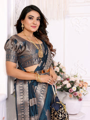 Woman in traditional attire with floral decorations in the background