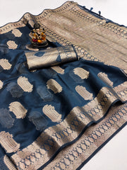 Blue and beige saree with intricate patterns on a white background