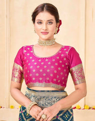 Woman wearing a pink blouse with gold patterns on a beige background