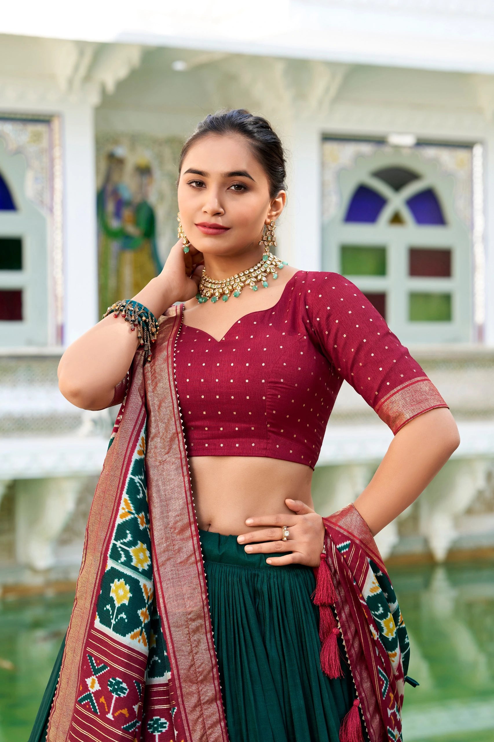 Woman in traditional attire with a colorful background