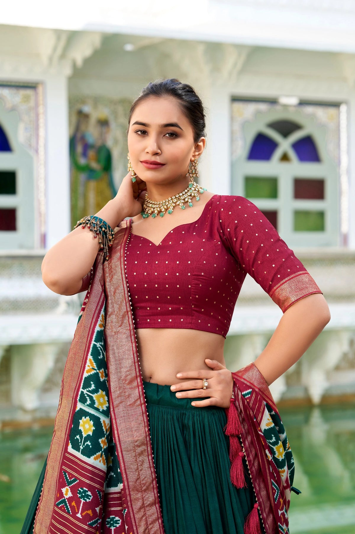Woman in traditional attire with a colorful background