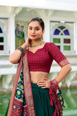 Woman in traditional attire with a colorful background