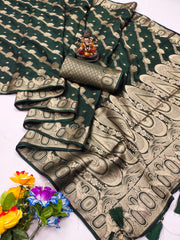 Green and gold saree with floral decorations on a white background