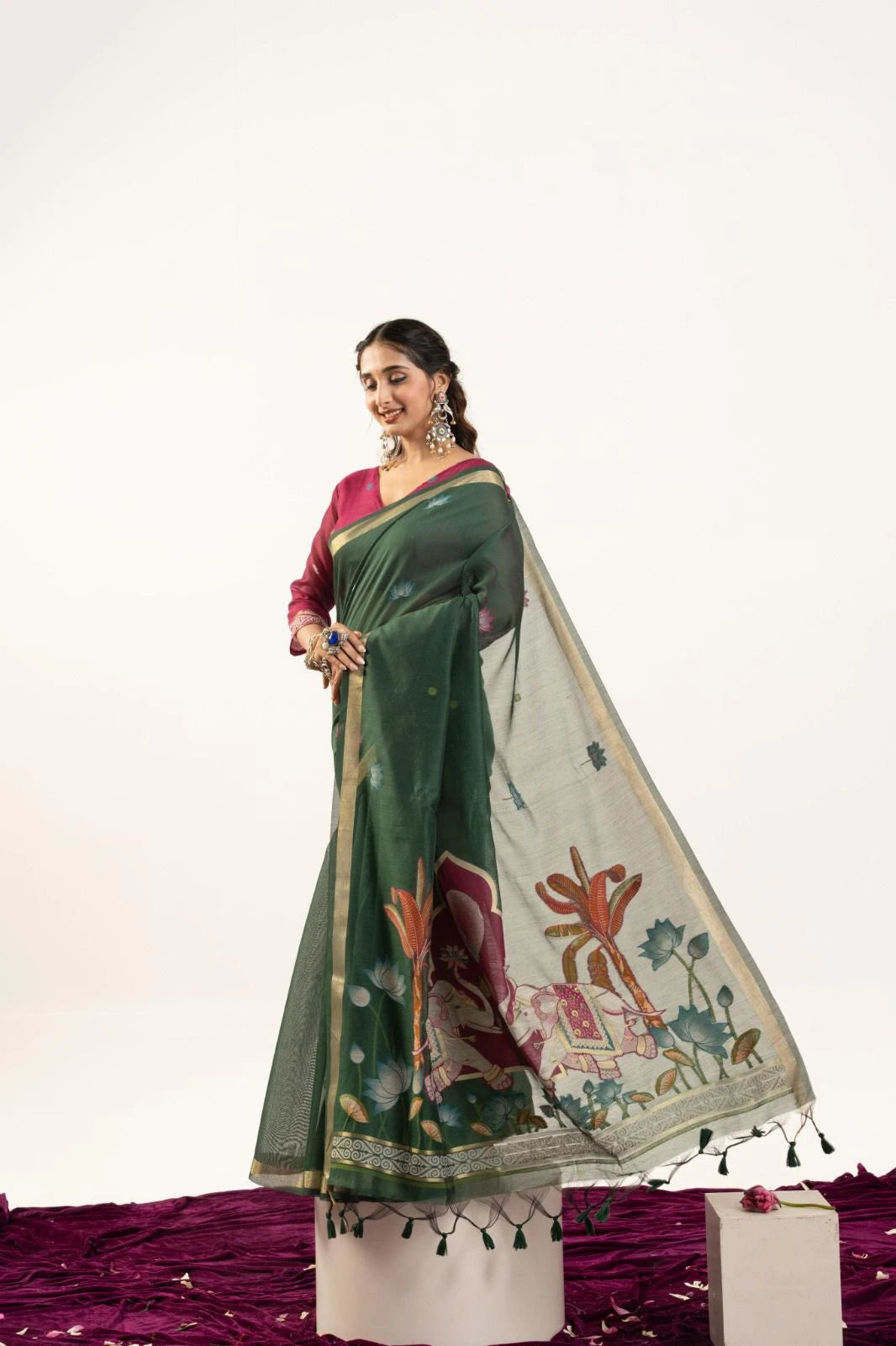 Woman wearing a green and white traditional outfit with a floral design on a white background