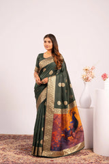 Woman wearing a green saree with gold and multicolor patterns on a white background
