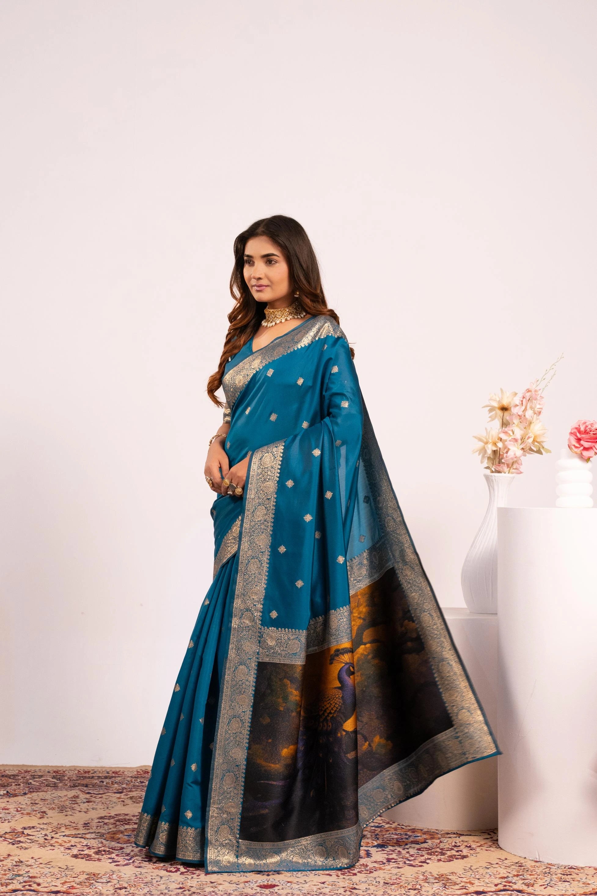 Woman wearing a blue saree with a white background