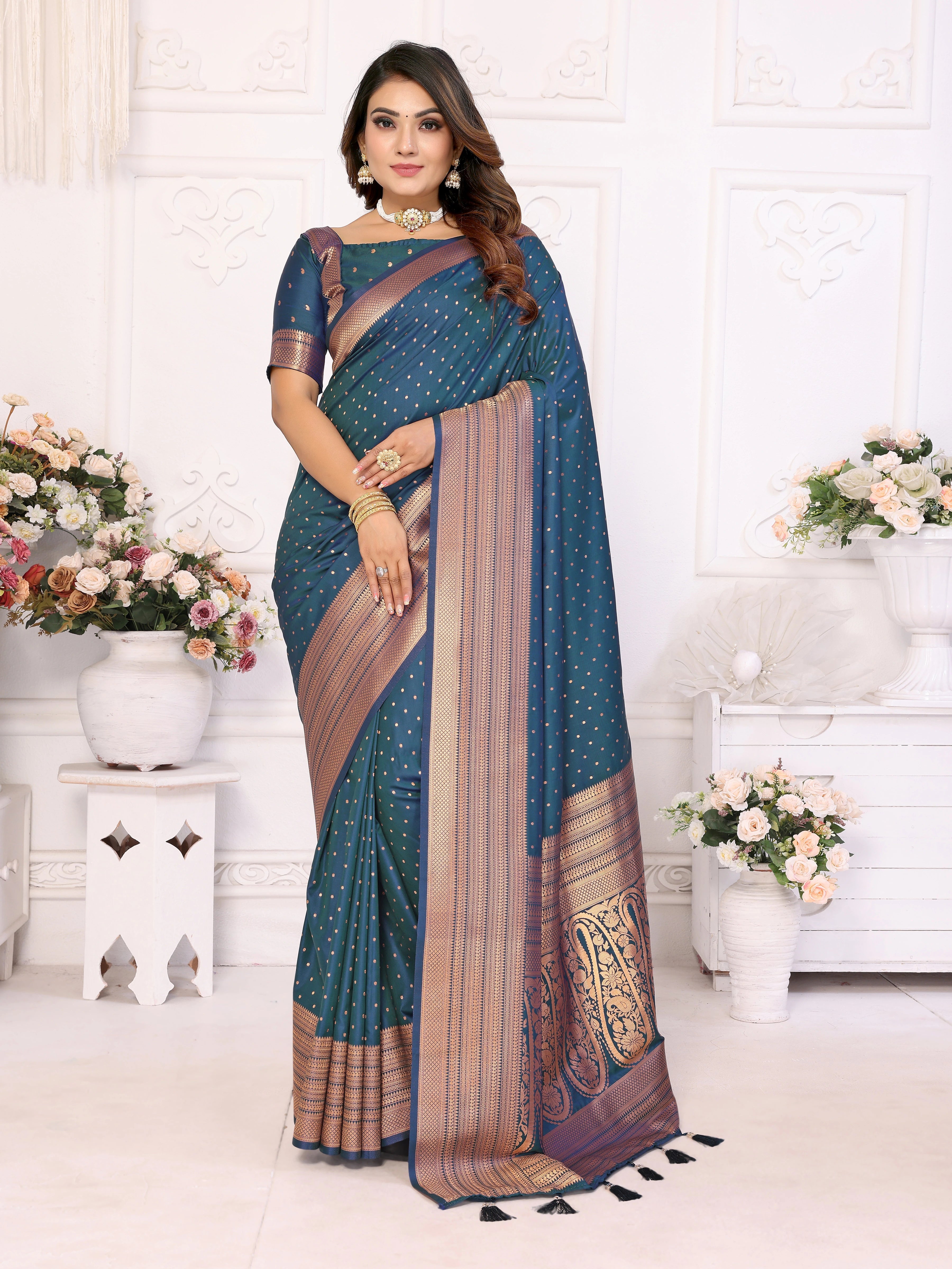 Woman wearing a blue saree with a white background