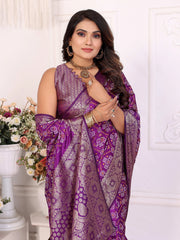 Woman wearing a purple saree with a white background