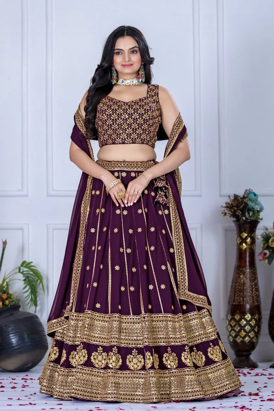 Woman wearing a traditional purple and gold outfit with a white background