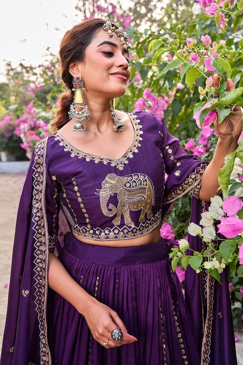 Traditional deep purple embroidered lehenga with ornate sequins and thread detailing.