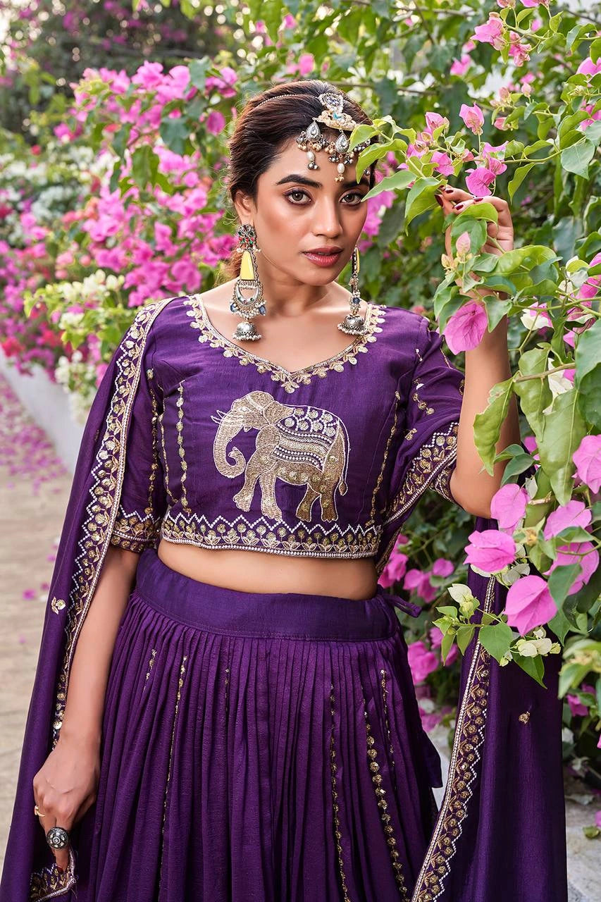 Elegant deep purple lehenga featuring intricate thread embroidery and shimmering sequins.