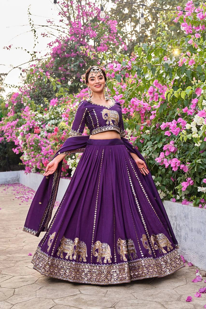 Close-up of deep purple lehenga highlighting delicate moti embellishments and fine craftsmanship.