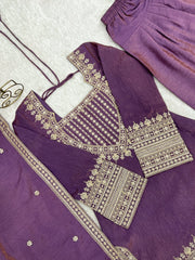 Purple traditional outfit with gold embroidery on a white background