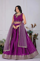 Woman wearing a purple traditional outfit with a white background