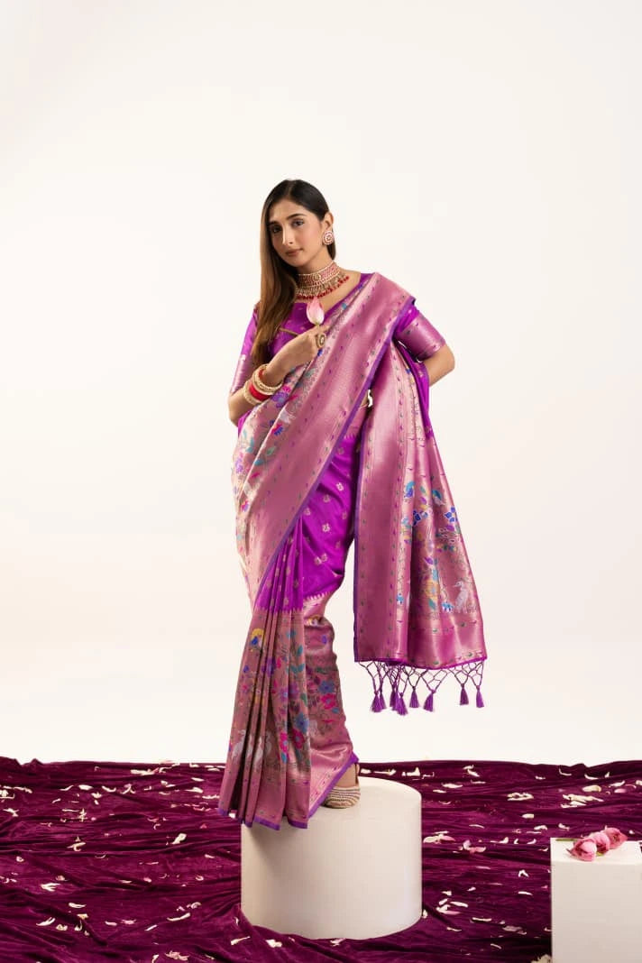Woman wearing a pink saree with a white background
