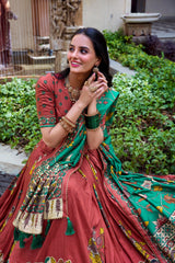Beautiful maroon Kalamkari saree featuring a rich green floral pallu with heritage-inspired ethnic motifs.