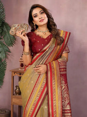 Woman in a traditional saree holding a clutch against a plain background