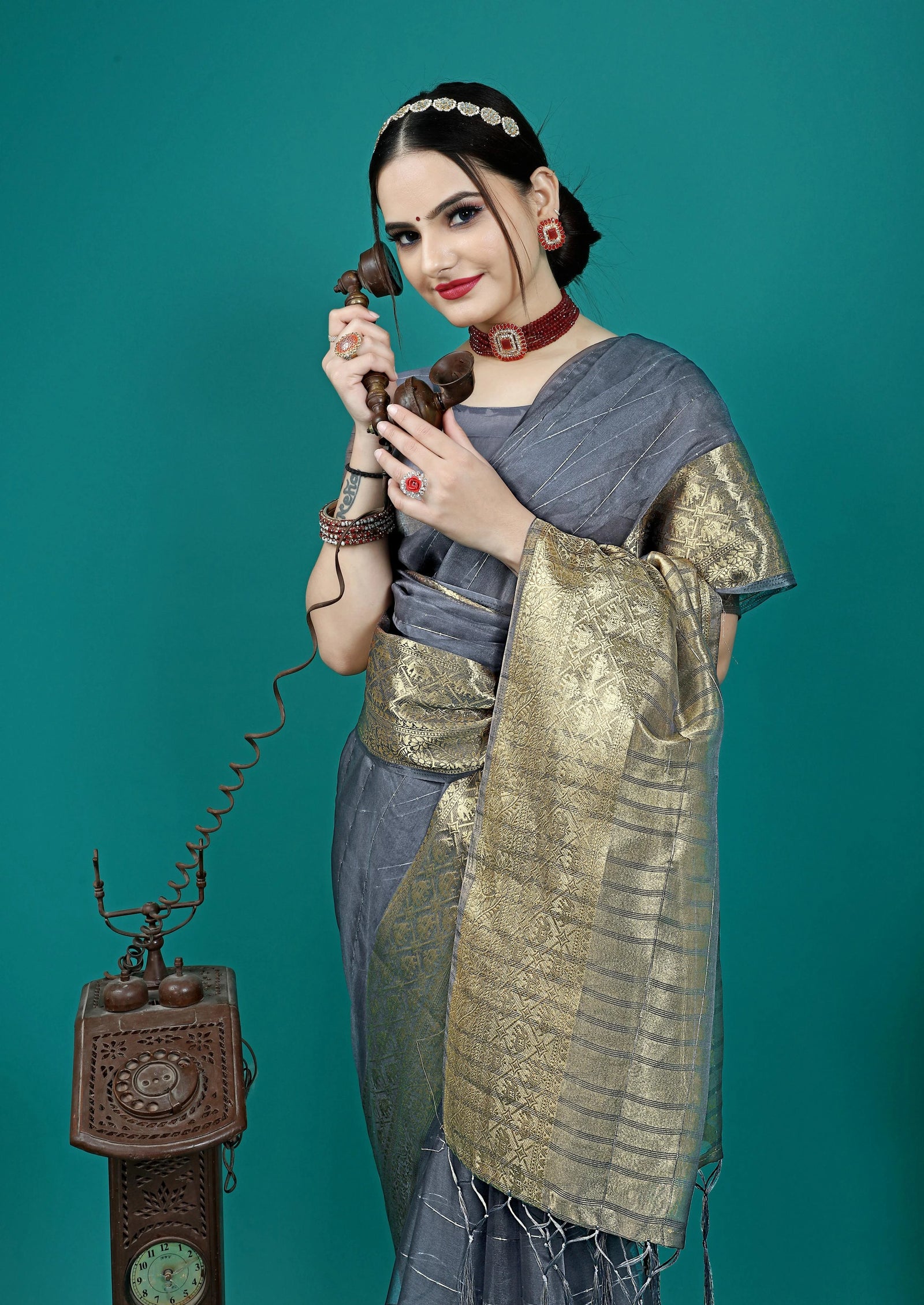 Designer party wear saree paired with matching blouse for festive occasions.
