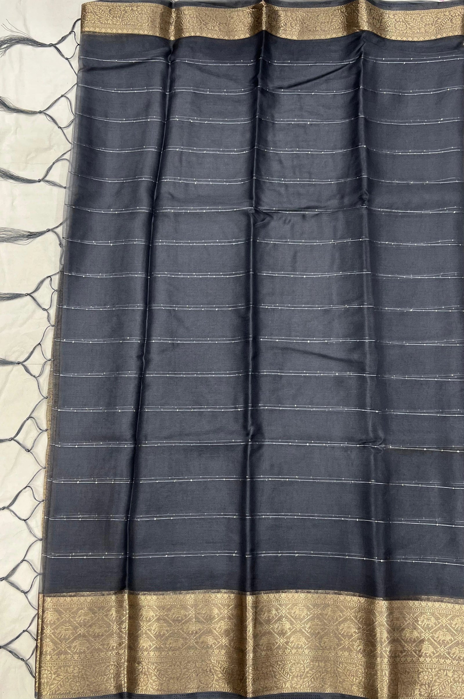 Graceful Indian saree showcasing luxurious texture and classic woven patterns.